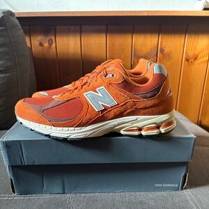 Men’s New Balance 2002r in rust orange.  Brand new!  Size 13